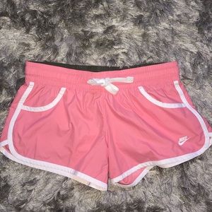pink Nike athletic shorts
